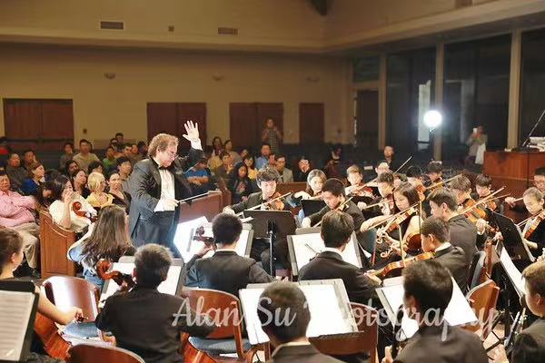 AmeriCal Youth Symphony performing before an audience