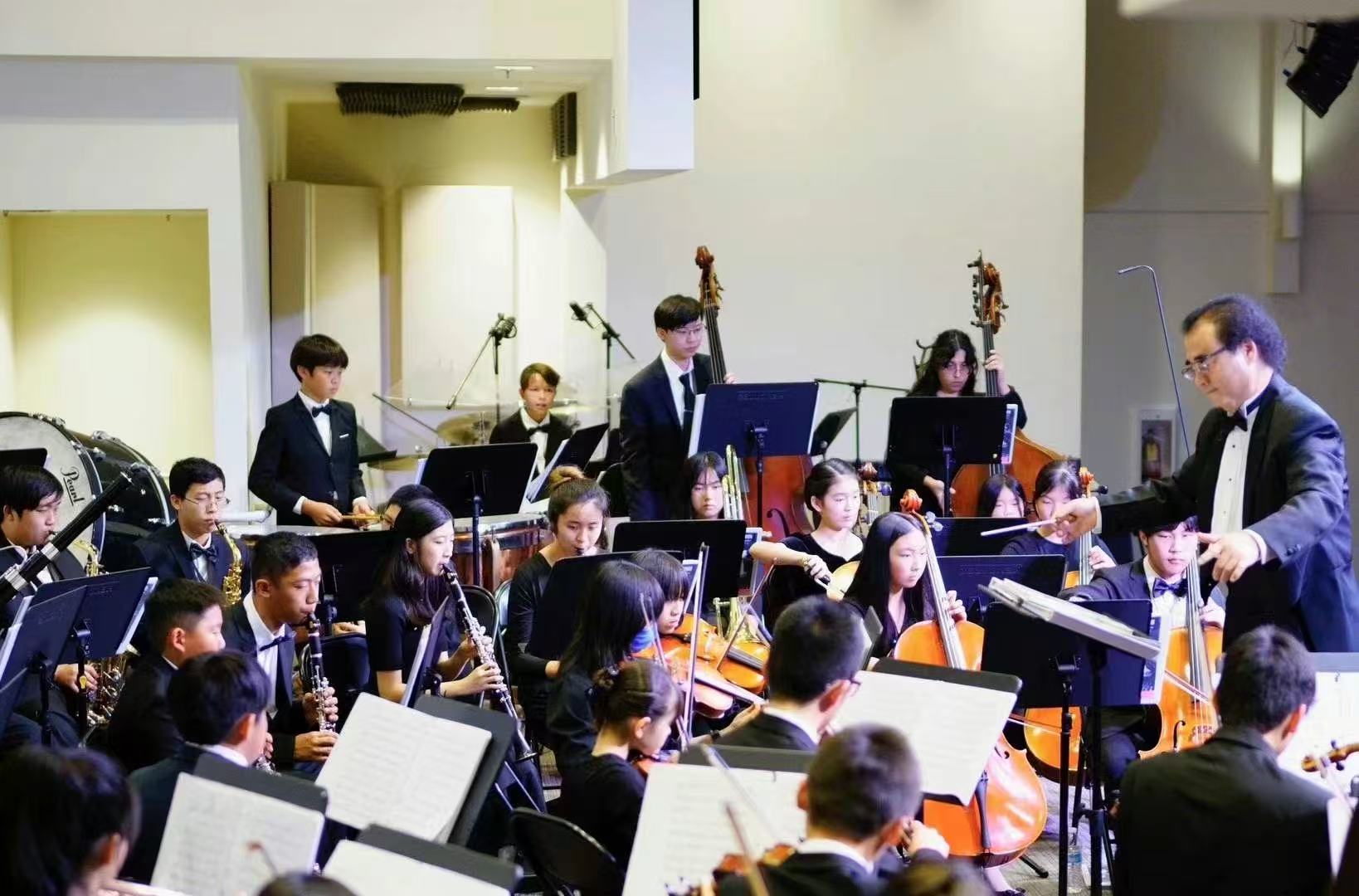 The conductor leading AmeriCal Youth Symphony