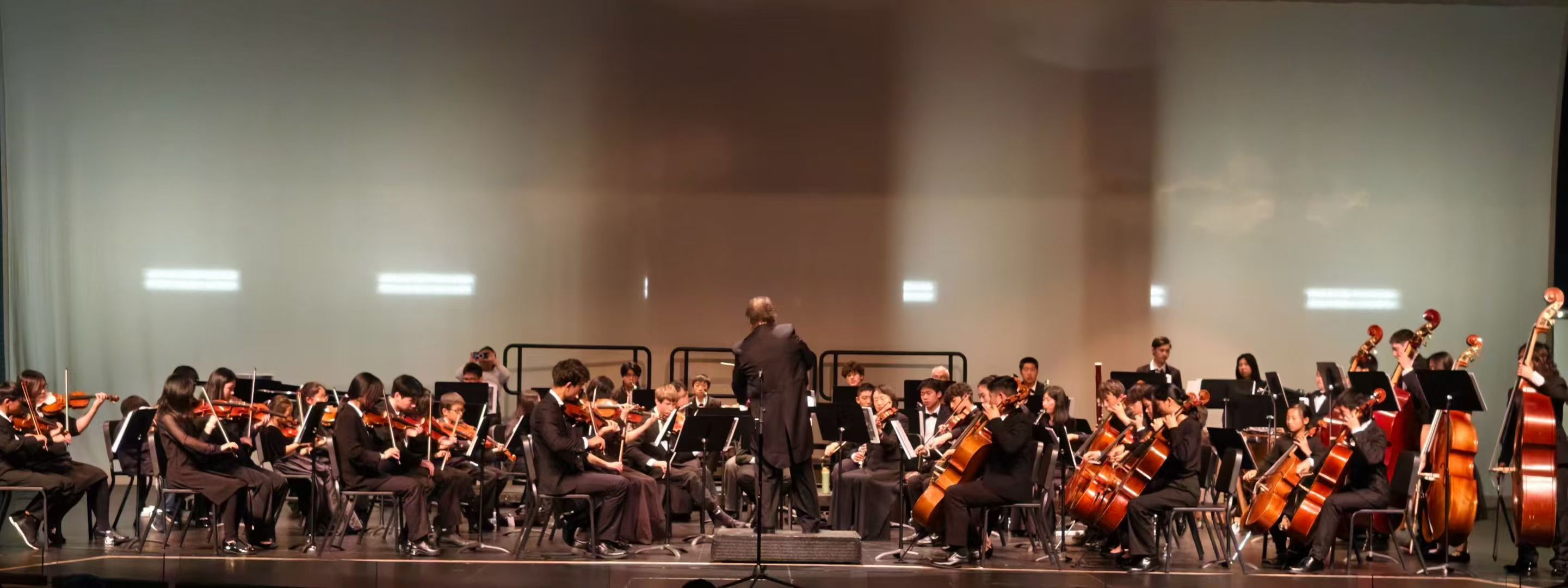 The full AmeriCal Youth Symphony performing onstage