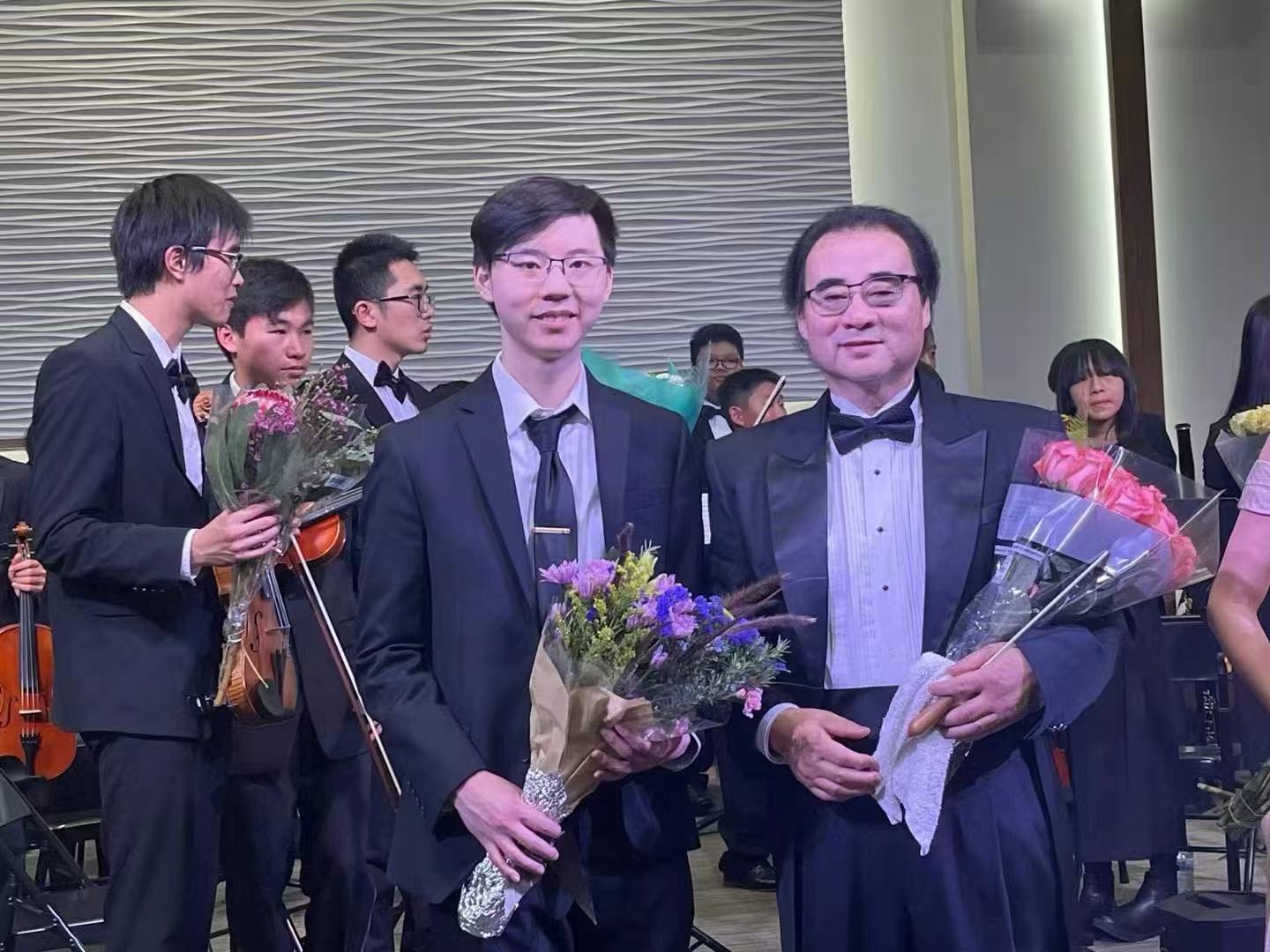 An AmeriCal student musician and conductor celebrating after a performance
