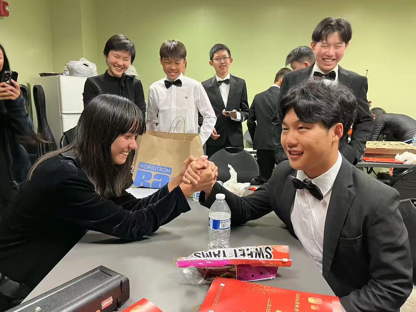 AmeriCal musicians sharing a joyful backstage moment