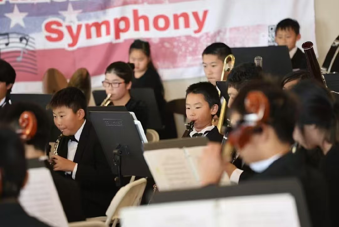 Young AmeriCal wind musicians performing